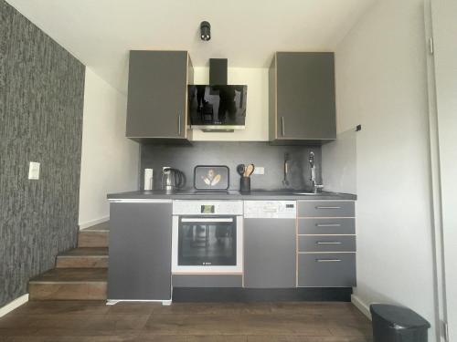 Kuchyň nebo kuchyňský kout v ubytování GRYT Home - Appartment L - Nähe Nordsee