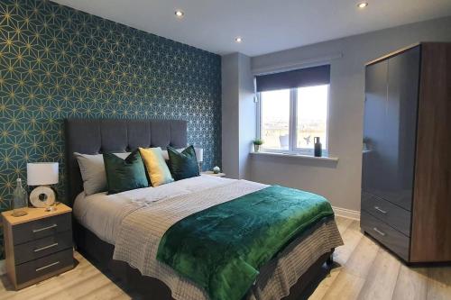 a bedroom with a large bed and a window at Inviting 1-Bed Apartment in the heart of Sheffield in Sheffield