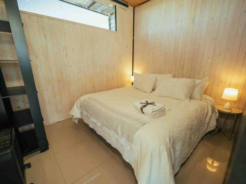 Tempat tidur dalam kamar di Casa Loft Vista Increíble incluye jacuzzi