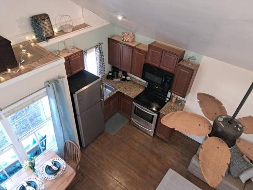 an overhead view of a kitchen with wooden cabinets at The Cottage at Moore House in Florence