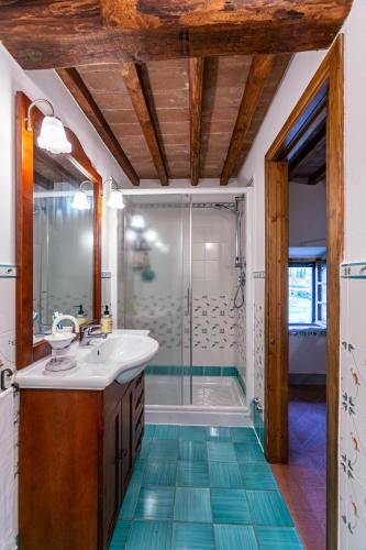 a bathroom with a sink and a shower at Le Scope 5* in Villa