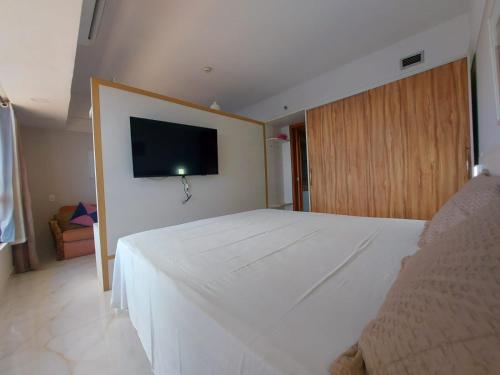 Una cama o camas en una habitación de Flat Tropical Executive
