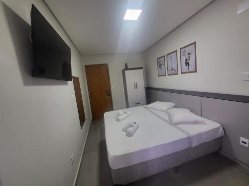 Postel nebo postele na pokoji v ubytování Hotel Avelar