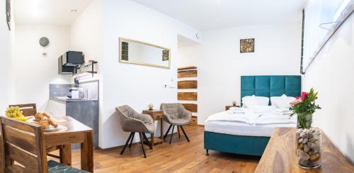 Postel nebo postele na pokoji v ubytování Luxusní studio v resortu v srdci Krkonoš