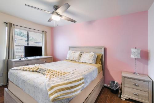 a bedroom with a bed and a ceiling fan at Cozy 3BR Home Escape, Modern & Serene in Dickinson