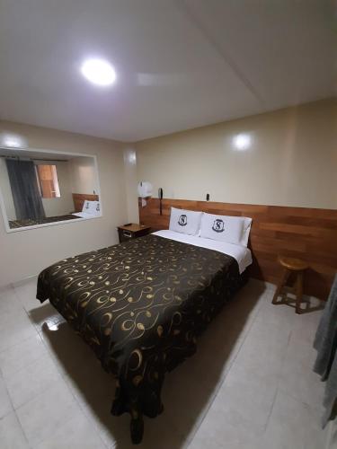 Postel nebo postele na pokoji v ubytování Hotel Nuevo Siboney