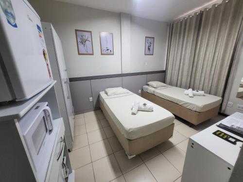 Postel nebo postele na pokoji v ubytování Hotel Avelar