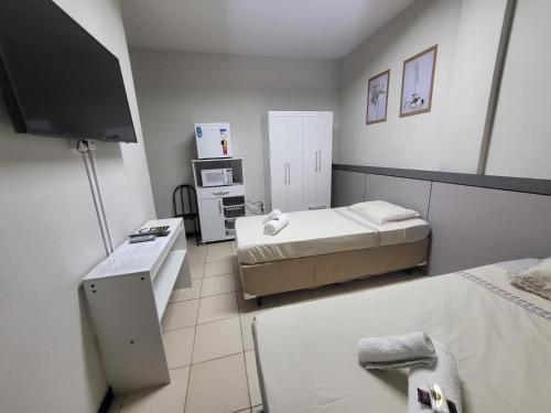 Postel nebo postele na pokoji v ubytování Hotel Avelar