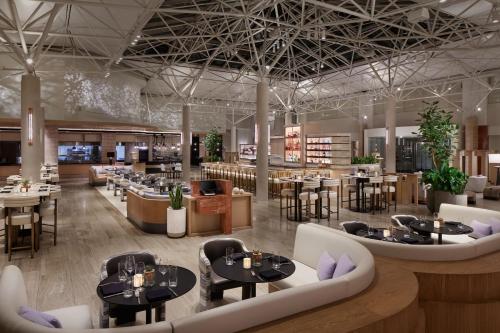 a rendering of a restaurant with tables and chairs at The Westin Washington, DC Downtown in Washington