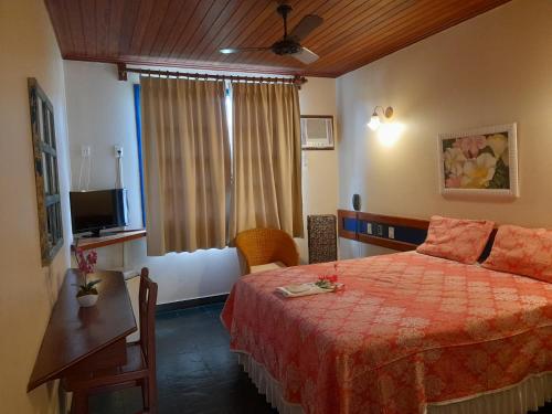 Una cama o camas en una habitación de Pousada Mucugê