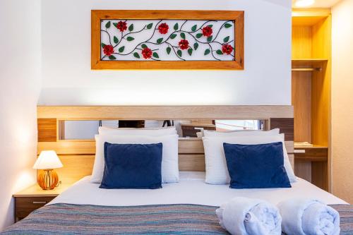 Una cama o camas en una habitación de Pousada das Videiras