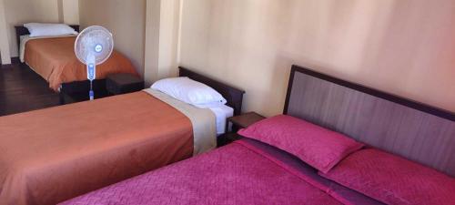 Postel nebo postele na pokoji v ubytování HOTEL DACIN
