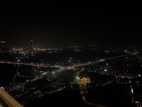 an aerial view of a city at night at The Opulence Suite 41st Floor City View in Noida