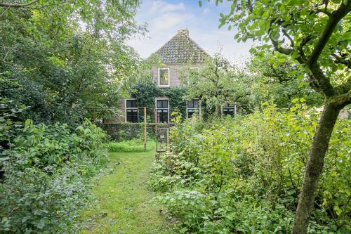 Taman di luar Voorhuis 2 personen - De Kruidenhoeve in het Reestdal -