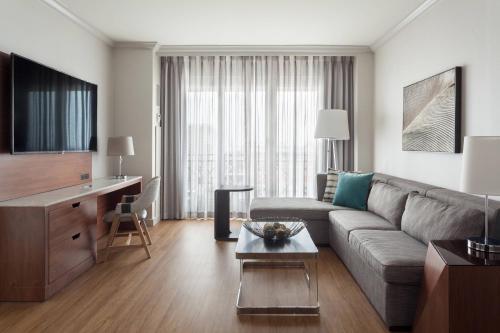 a living room with a couch and a table at Tampa Marriott Water Street in Tampa