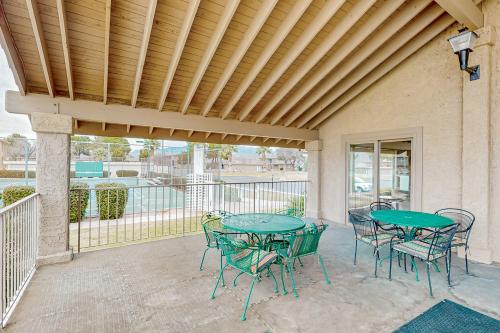 a patio with tables and chairs on a balcony at Mountain Views at the Village in St. George