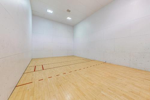 an empty gymnasium with a wooden basketball court at Mountain Views at the Village in St. George