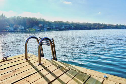 a dock on a body of water with houses at What a View in Bella Vista