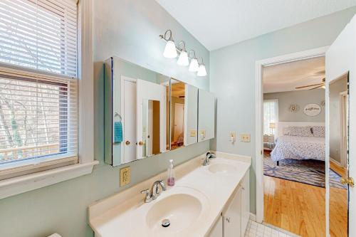 a bathroom with a sink and a mirror at Nantahala in Seneca