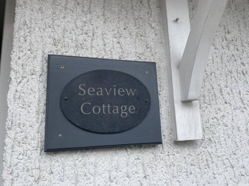 a sign on the side of a building at Sea view Cottage in Cleethorpes
