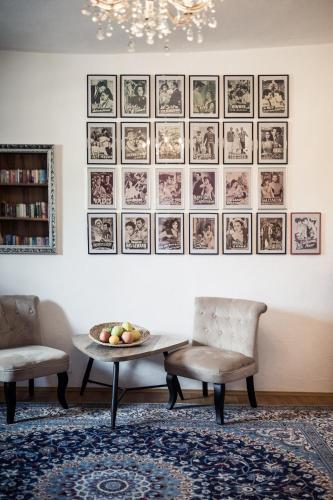 a dining room with a table and two chairs at Romantik Hotel Jagdhof in Caldaro