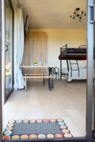 a room with two bunk beds and a rug on the floor at ValZur Hospedaje: Suite Arces in Villa del Carbón