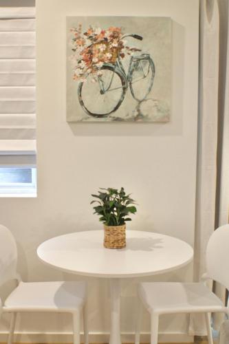 a white table with a bike painting on the wall at Minutes to Rock City, Ruby Falls, & Downtown in Chattanooga