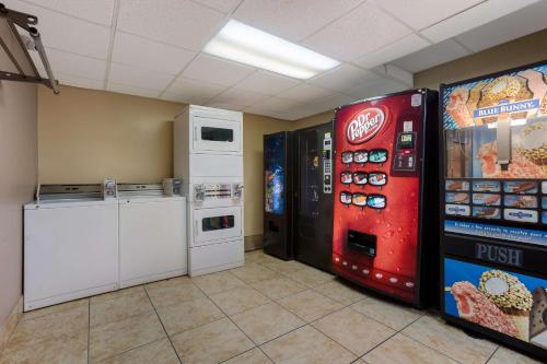 a room with a cocacola machine and a refrigerator at Best Western Music Capital Inn in Branson