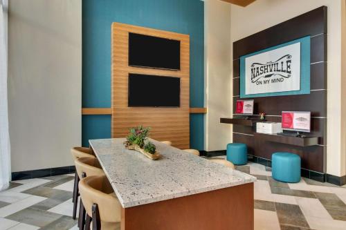 a dining room with a table and chairs at Drury Plaza Hotel Nashville Downtown in Nashville