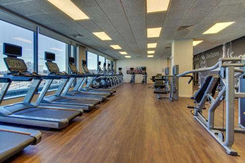 a gym with a row of treadmills and machines at Drury Plaza Hotel Nashville Downtown in Nashville