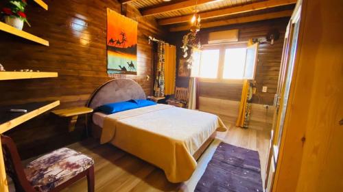 a bedroom with a bed in a wooden room at hakuna matata in Dahab