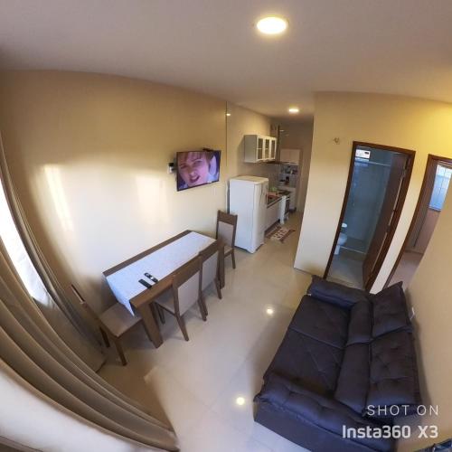 an overhead view of a dining room and kitchen with a table and a couch at Recanto dos Amigos in Santo Amaro