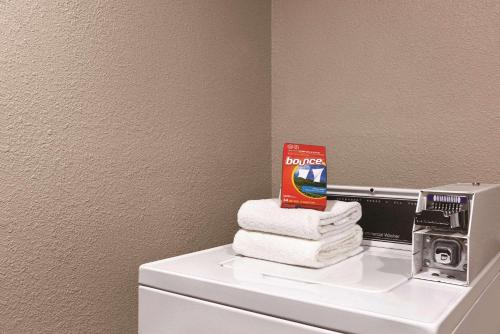 a pile of towels sitting on top of a refrigerator at Country Inn & Suites by Radisson, Abingdon, VA in Abingdon