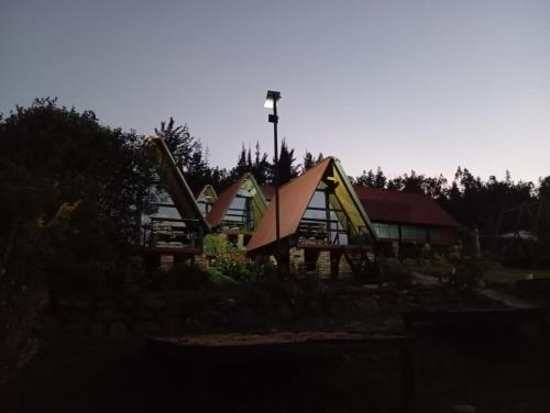 a park with a playground with a building at Hospedaje Villa Rosita Suesca in Suesca