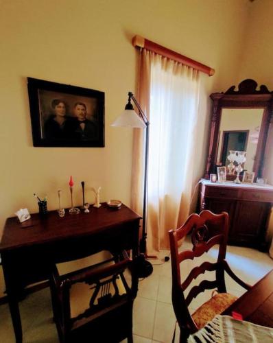 a room with a dining room table and a table and chairs at Apoikia house with sea view 6max in Apoíkia