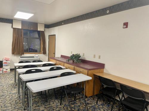 a classroom with rows of tables and chairs at SureStay by Best Western Prince Frederick in Prince Frederick