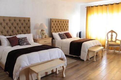 Voodi või voodid majutusasutuse Hotel-Spa Posada Bonita toas