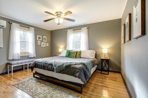 a bedroom with a bed and a ceiling fan at Pet-Friendly Wilmington Retreat with Hot Tub! in Wilmington