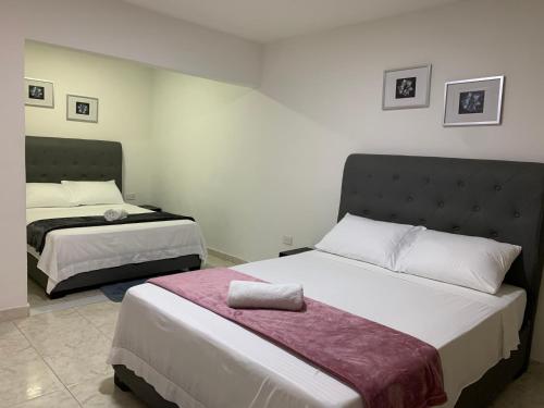 Ένα ή περισσότερα κρεβάτια σε δωμάτιο στο BH Di Apartment