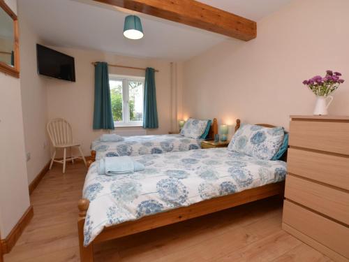 a bedroom with two beds and a window at 2 bed in Sherborne 50447 in Yetminster