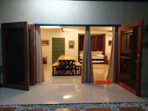 a room with a door open to a bedroom at YB Rooftop Residence in General Santos
