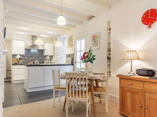 a kitchen and dining room with a table and chairs at 2 Bed in Brixham 86879 in Brixham