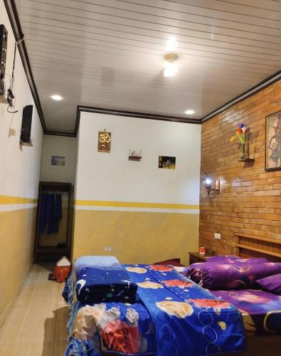 a bedroom with two beds in a room at Adem Ayem in Ngadisari