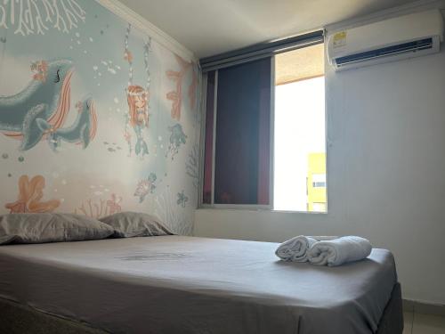 Apartamento cerca a zonas exclusivas de Barranquilla tesisinde bir odada yatak veya yataklar