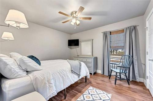 a bedroom with a bed and a ceiling fan at House of Charm! Bike Trails & New Walmart HQ in Bentonville