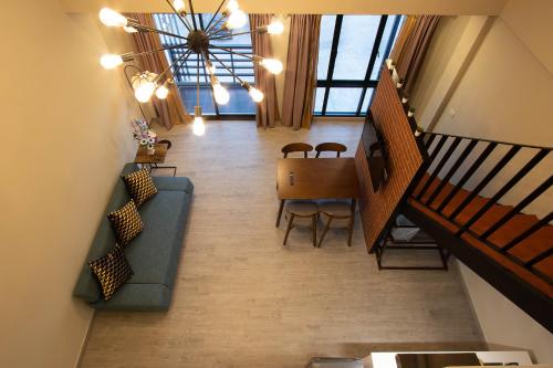 a living room with a couch and a table at Gate78 Hostel Maephim Beach in Mae Pim