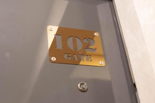 a sign on a door with the number gate at Gate78 Hostel Maephim Beach in Mae Pim