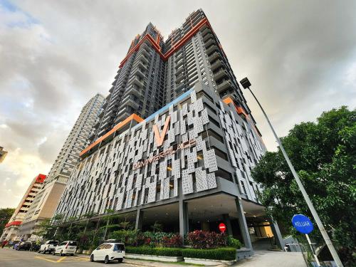 a large building with a sign on the side of it at Loft Suite Central City 2BR JB CIQ 7Pax in Johor Bahru