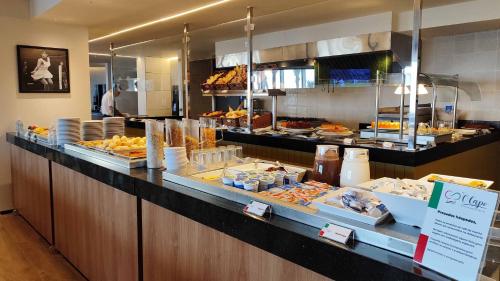 a buffet line with many different types of food at Holiday Inn Fortaleza by IHG in Fortaleza