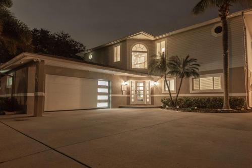a large house with a garage at night at Villa Azule in Clearwater Beach